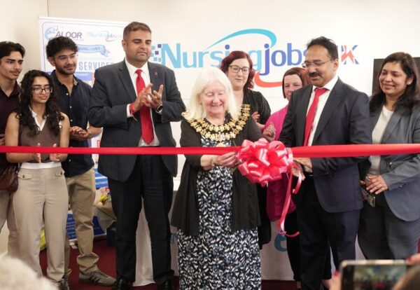 Cutting the ribbon with the Mayor and MP of Stockport
